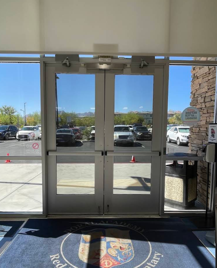 Commercial entry doors framed by sidelights after film installation