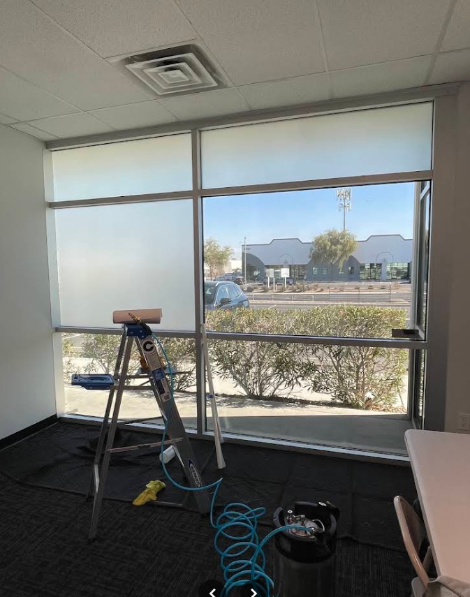 Commercial office window wall with partial privacy film installation