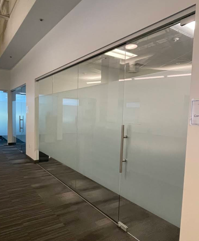 Frosted glass office wall with full-height privacy film