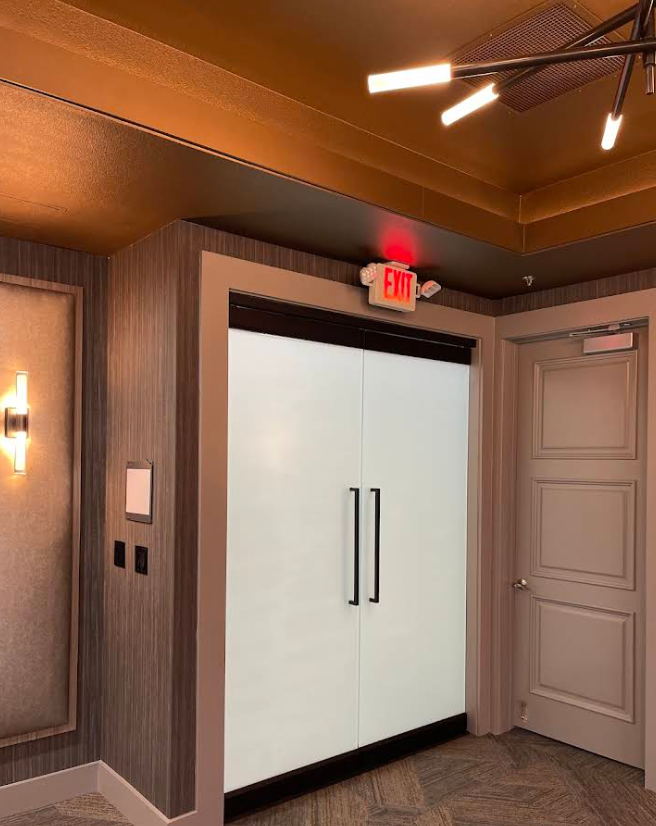 Frosted double doors with privacy film in a commercial interior