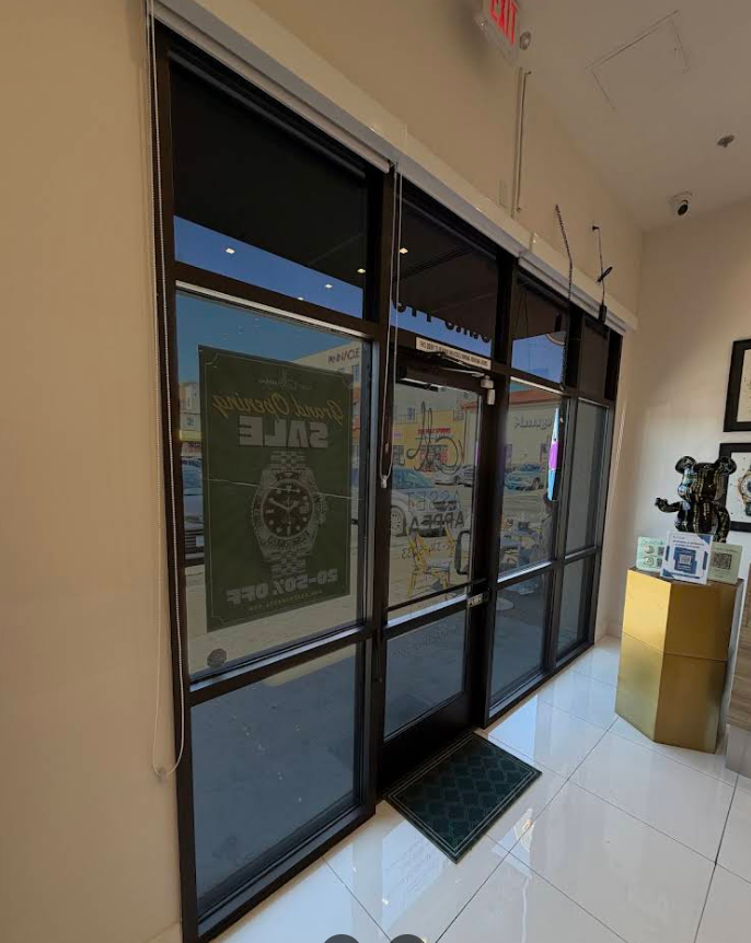 Tinted storefront entry with dark commercial film